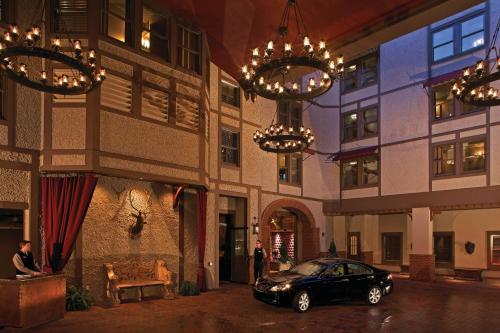 a car parked in front of a building with chandeliers at Grand Bohemian Lodge Asheville, Autograph Collection in Asheville
