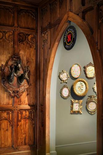 an archway with plates on a wooden wall at Grand Bohemian Lodge Asheville, Autograph Collection in Asheville