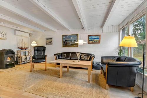 a living room with a couch and a table at BV395-Oksbol-Graevlingevej-1 in Oksbøl