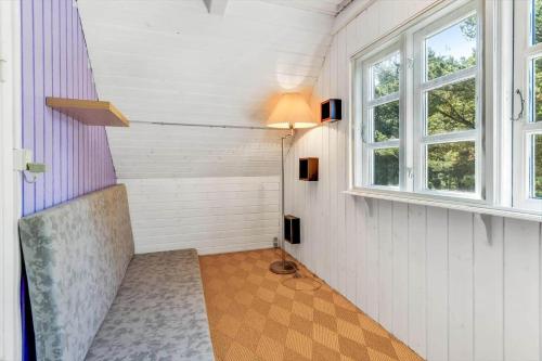 a small room with a window and a chair at BV395-Oksbol-Graevlingevej-1 in Oksbøl