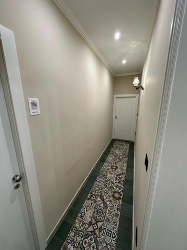 a hallway with a tile floor and a door at B&B Ai Templi Paestum in Stazione di Paestum