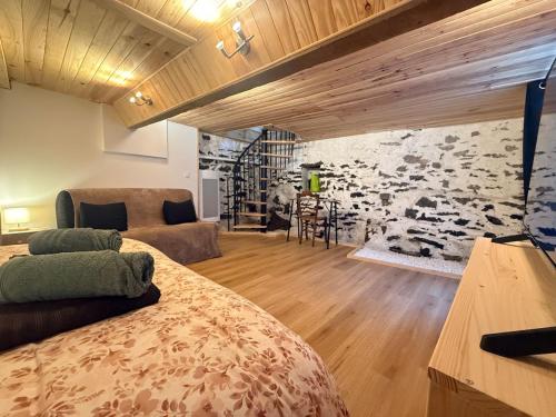 a room with a bed and a wall with cows at L' Altitude Billard Proche Stations Cols in Saint-Michel-de-Maurienne