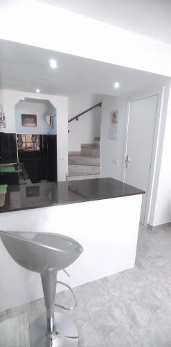 a bathroom with a sink in a room with stairs at Castillo Mar 95 in Caleta De Fuste
