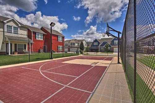 a basketball court in front of a house at Poolside Bliss and Lake Fun Monkey Island Retreat! in Afton