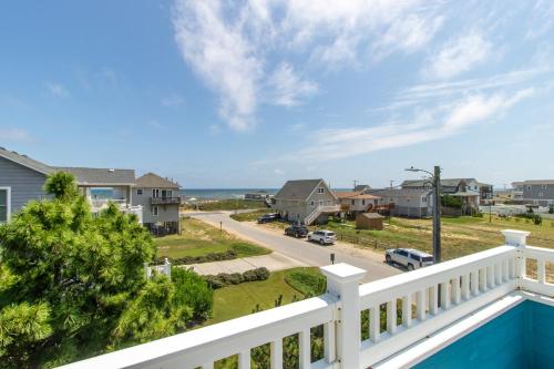 a balcony with a view of a street at H&H III - K0020 in Kitty Hawk