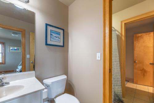 a bathroom with a toilet and a sink and a shower at H&H III - K0020 in Kitty Hawk