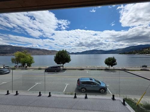 a car parked in a parking lot next to a lake at Premium Deluxe PeachView Suites 3BR in Peachland