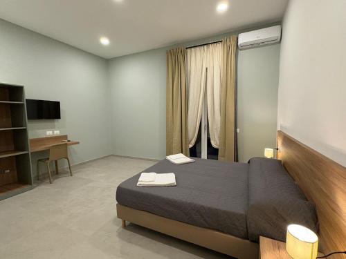 Postel nebo postele na pokoji v ubytování Calì room