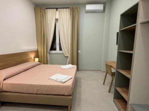 Postel nebo postele na pokoji v ubytování Calì room