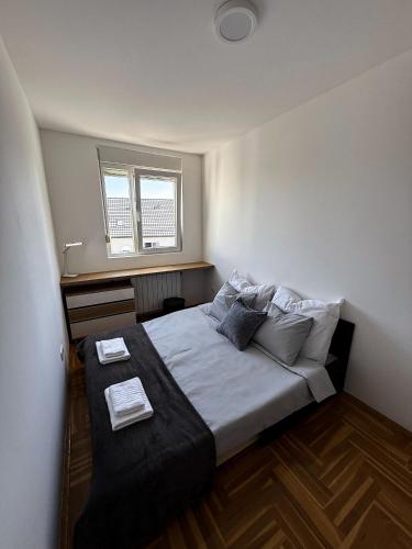 a bedroom with a large bed in a room at Limpio Apartman 2 in Belgrade