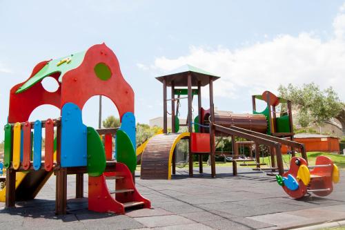 a park with a playground with a slide at RVHotels Ametlla Mar in L'Ametlla de Mar