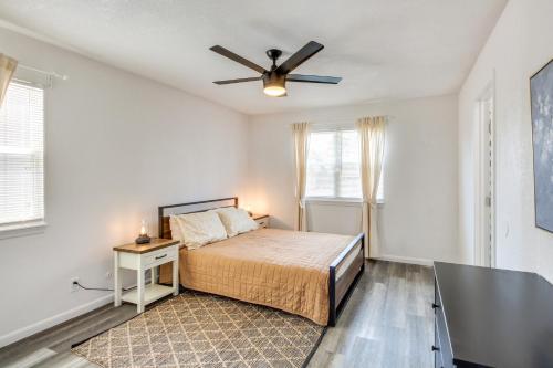 a bedroom with a bed and a ceiling fan at Pet-Friendly Overland Park Condo with Pool Access! in Overland Park