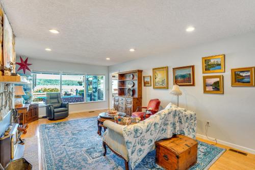 a living room with a couch and a table at Across Water From Belfair SP Hood Canal Cottage! in Belfair