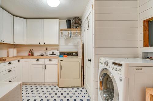 a kitchen with a washer and dryer in it at Across Water From Belfair SP Hood Canal Cottage! in Belfair