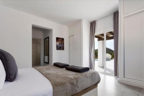 Una cama o camas en una habitación de Villa Boutique Balafi