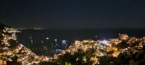 a view of a city at night with lights at Cielo e Mare in Positano