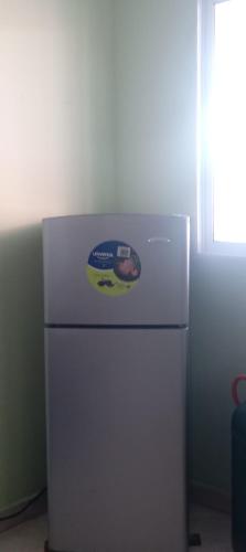 a refrigerator with a sticker on the top of it at Apartamento central Yahweh in San Andrés