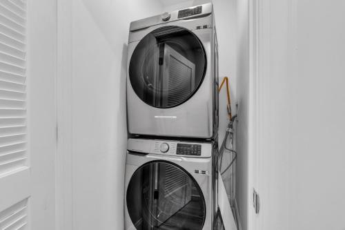 a stack of washing machines and a dryer at Best 4br Home Great Kitchen, Wifi, Parking For 3 in Seaside Heights
