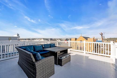 a patio with a table and chairs on a balcony at Best 4br Home Great Kitchen, Wifi, Parking For 3 in Seaside Heights