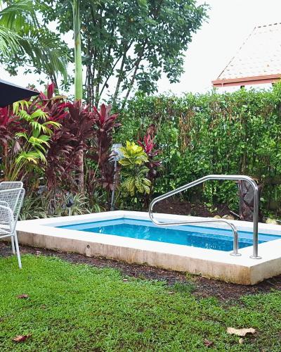 a small swimming pool in a yard at Arenals Peak Villas in Agua Azul