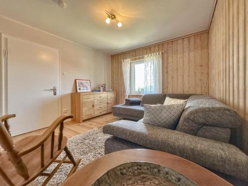 a living room with a couch and a chair at Hochfels in Stadlern
