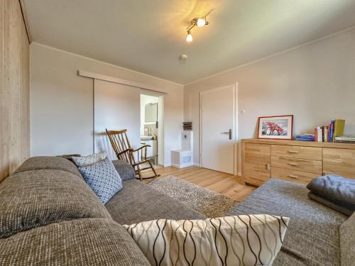 a living room with a couch and a dresser at Hochfels in Stadlern