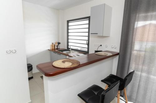 Cuisine ou kitchenette dans l'établissement Le Nid de Thalys - Charming Apartment