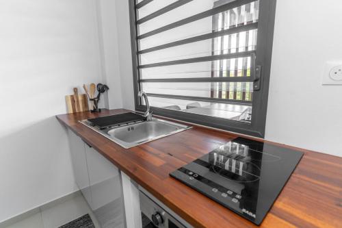 Cuisine ou kitchenette dans l'établissement Le Nid de Thalys - Charming Apartment