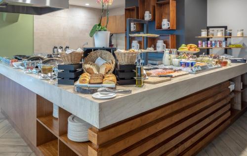 a breakfast buffet with food on a table at Sheraton San Jose Hotel, Costa Rica in San José