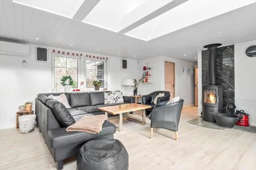 a living room with a couch and a table at BV276-Blavand-Sonder-Vasevej-150 in Blåvand
