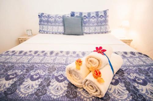Giường trong phòng chung tại Canto das Laranjeiras Tombo
