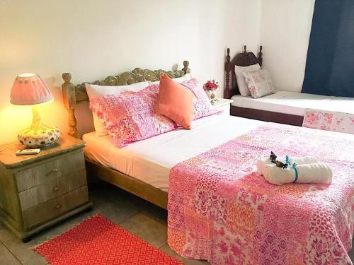 Giường trong phòng chung tại Canto das Laranjeiras Tombo
