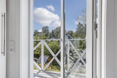 an open door with a view of a bridge at 13383-Asnaes-Glentevej-15 in Asnæs