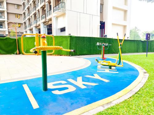 a playground with two play equipment in a park at Apt SKY house 2br cozy & family in Cisauk 1