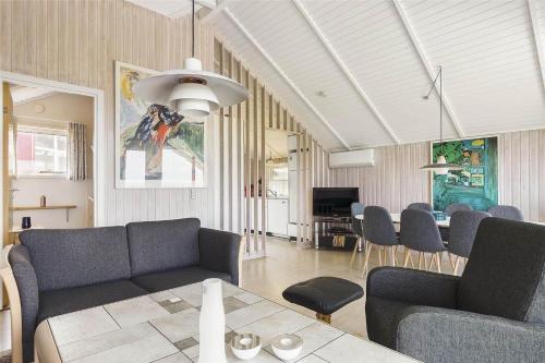 a living room with a couch and a table at 17701-Follenslev-Middelvej-2 in Føllenslev