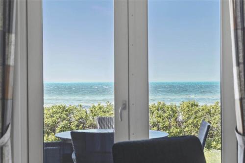 a room with a view of the ocean through a window at 17701-Follenslev-Middelvej-2 in Føllenslev