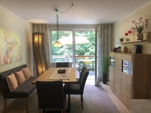 a dining room with a table and chairs and a window at Schwarzatal Trippstein 2 in Schwarzburg