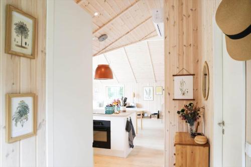 a room with a kitchen with a table and a stove at 11866-Nykobing-Sj-Skippervej-17 in Nyrup