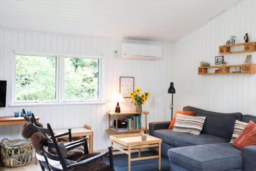 a living room with a couch and a table at 13373-Asnaes-Radyrvej-24 in Asnæs