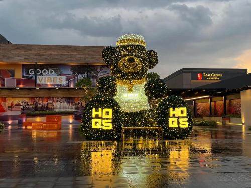 a large bear statue in front of a shopping center at SATU Hotel by Taslim Gading Serpong in Tangerang