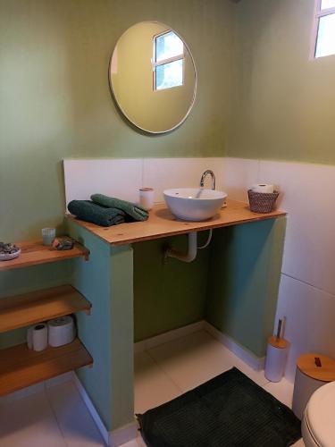 a bathroom with a sink and a mirror at Vista do Sincorá in Ibicoara