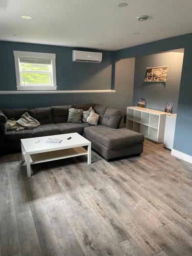 a living room with a couch and a coffee table at Harbours View in Portuguese Cove