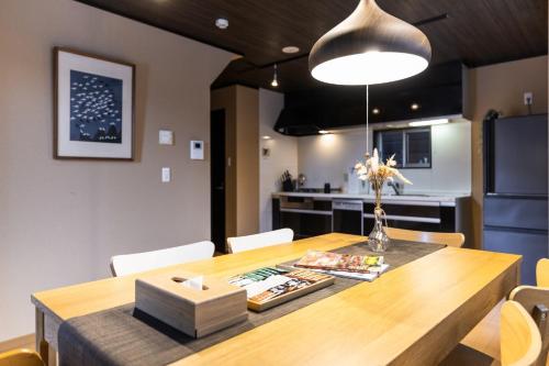 a kitchen and dining room with a wooden table at Kyoto - House - Vacation STAY 13833 in Kyoto