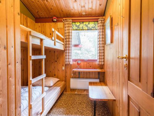 a room with two bunk beds and a sink at 4 person holiday home in Nørre Nebel in Nørre Nebel