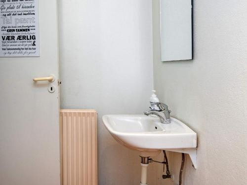 a bathroom with a sink and a mirror at 4 person holiday home in Ansager-By Traum in Ansager