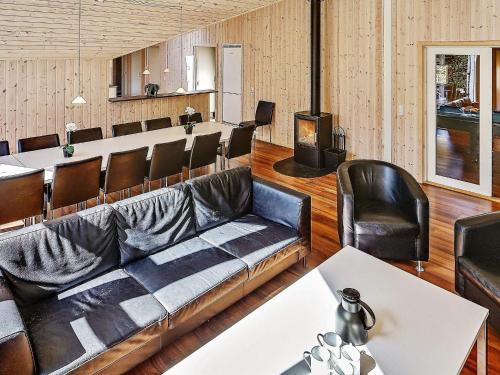 a living room with a couch and a stove at Luxury Retreat in Hornbaek - By Traum Ferienwohnungen in Hornbæk