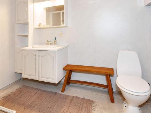 a bathroom with a toilet and a sink at 4 person holiday home in Læsø in Læsø