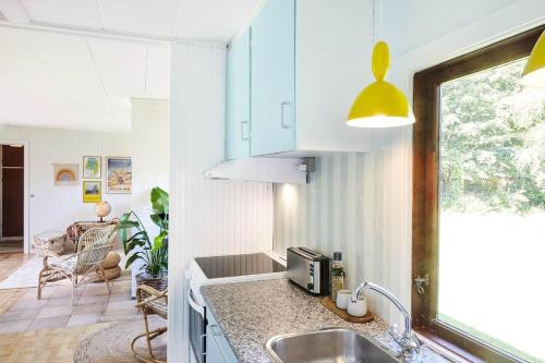 a kitchen with a sink and a counter top at 10000-1-Rorvig-Birkealle-2-A in Rørvig