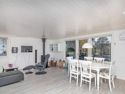 a living room with a white table and chairs at 5 person holiday home in Hals-By Traum in Hals