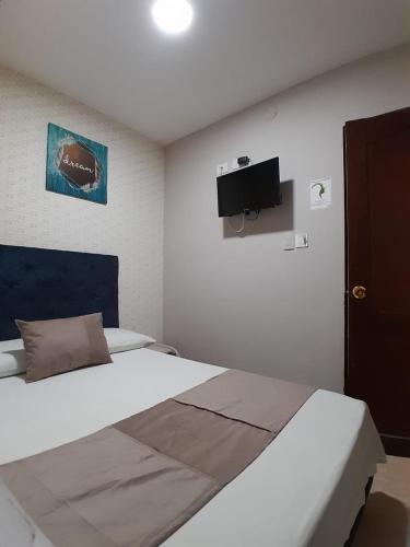 Una cama o camas en una habitación de Hotel Bahia Suite In